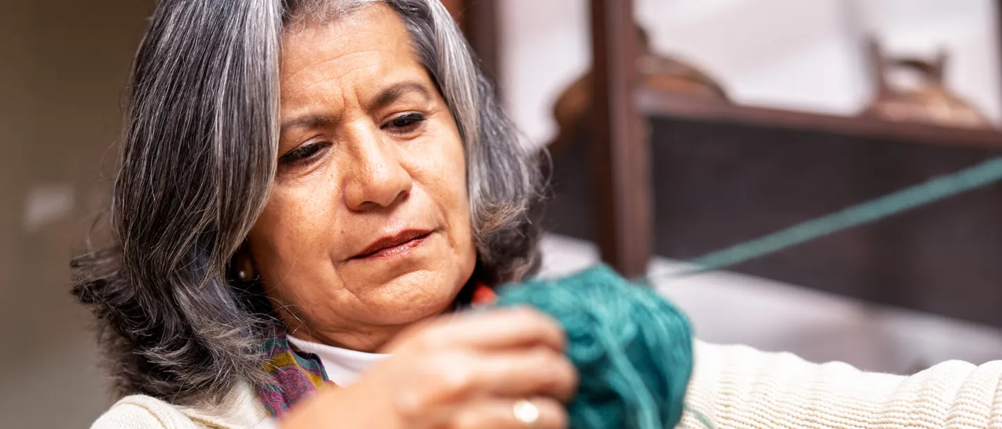 Woman holding yarn in her hands