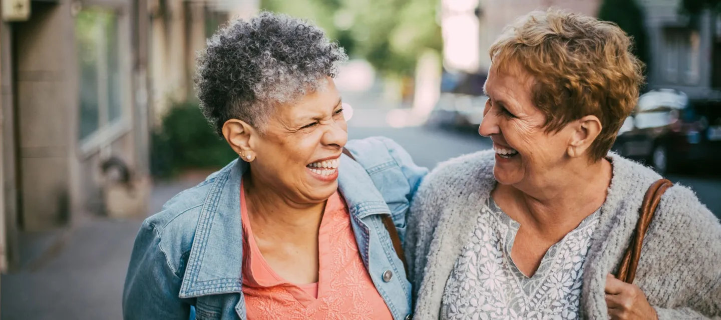 Two women smiling at each other
