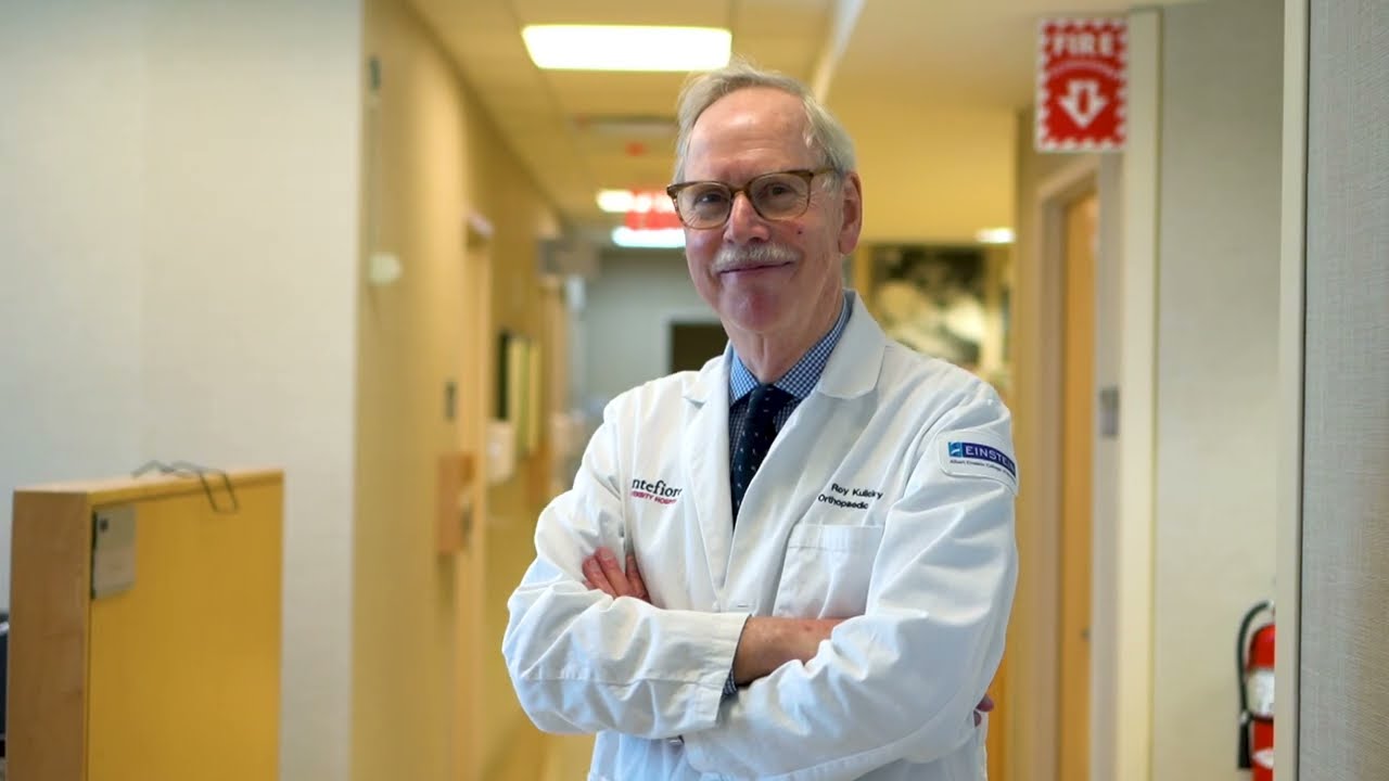 Roy Kulick, MD standing in a hospital hallway 