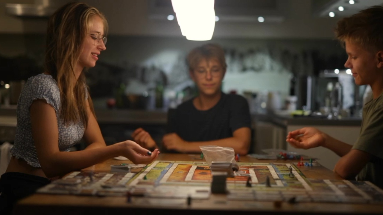 Family playing board game at home
