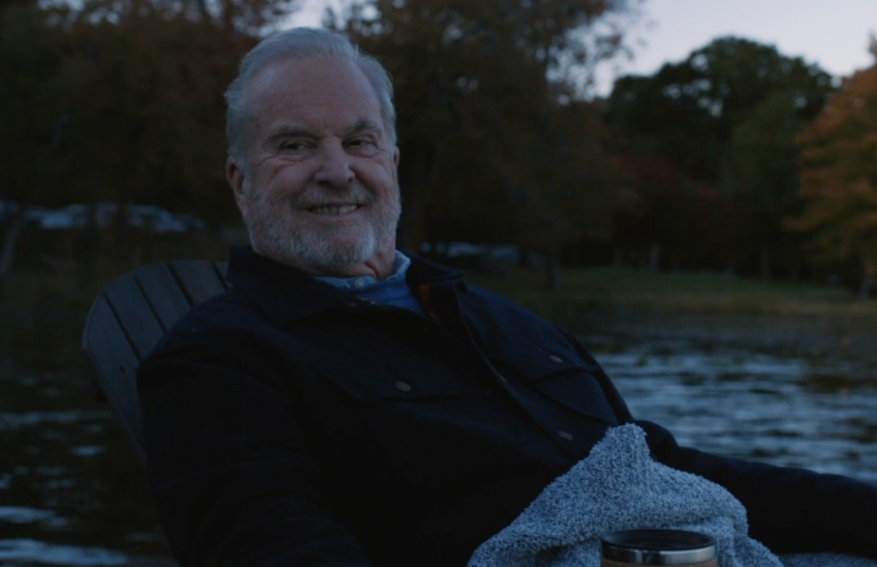 Montefiore Einstein Heart & Vacular Care patient, James Bradley, sitting by lake at dusk