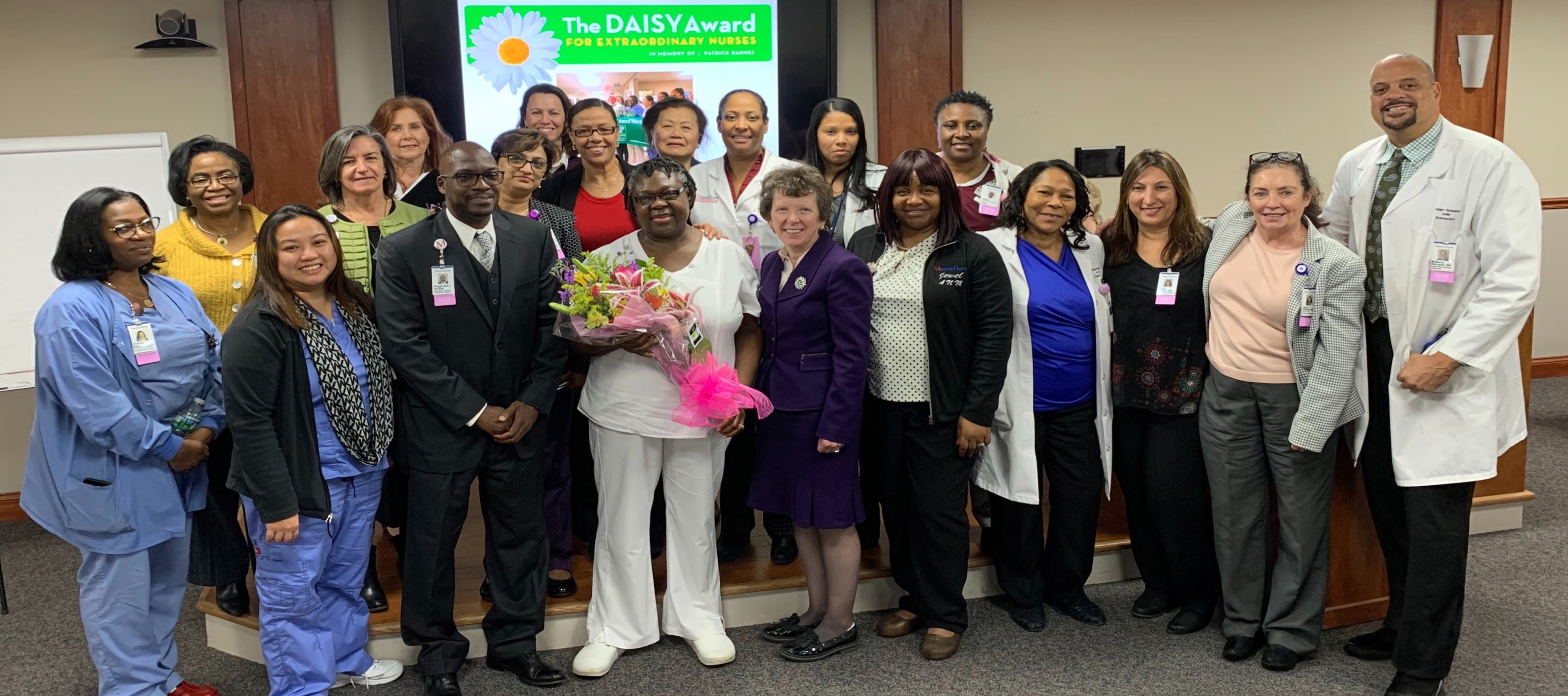 Group of doctors and nurses posing for the Daisy Awards
