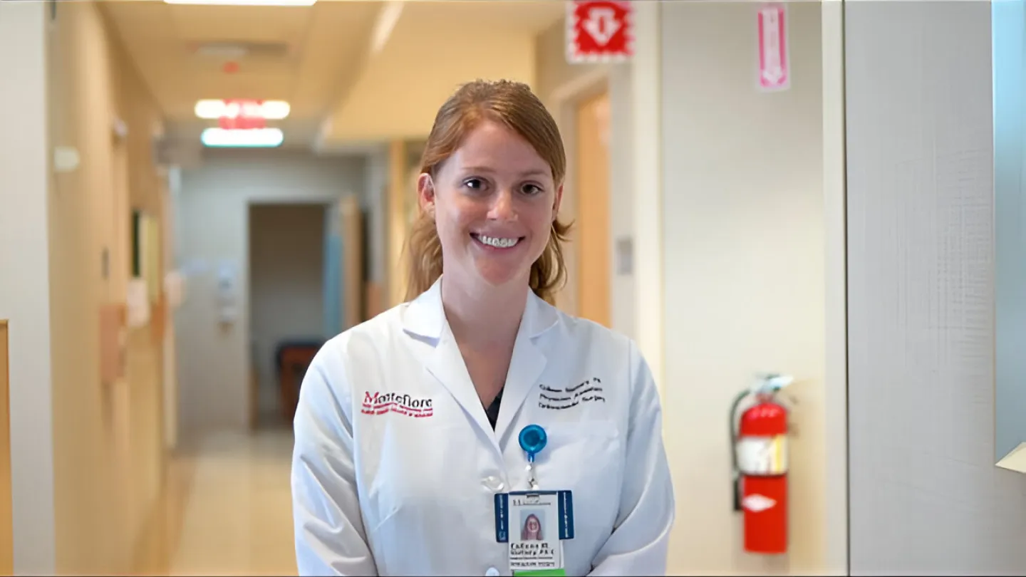 Colleen Slattery, PA standing in a hospital hallway