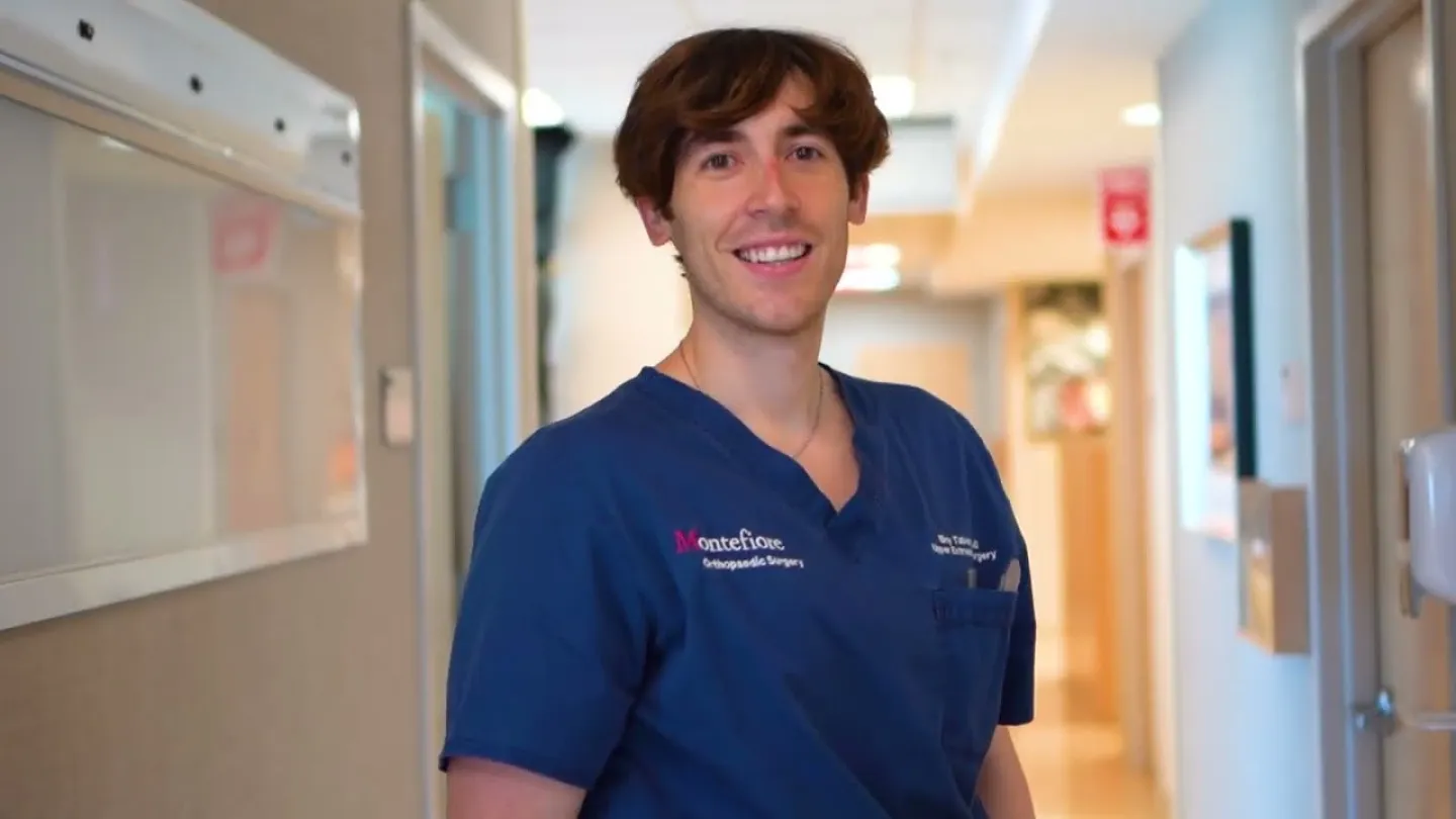 Eloy Tabeayo Alvarez, MD standing in a hospital hallway