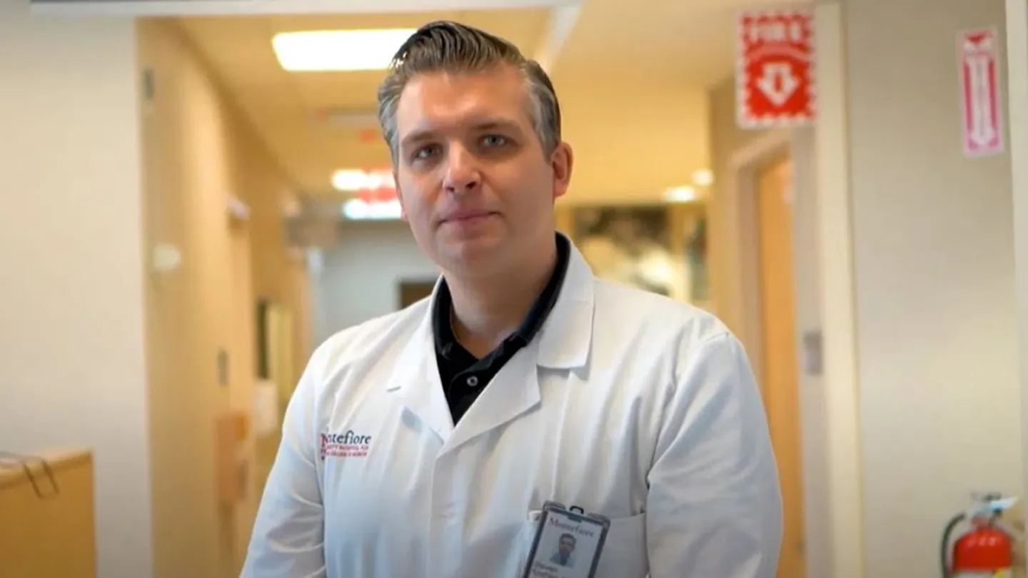 Steven Koehler, MD standing in a hospital hallway