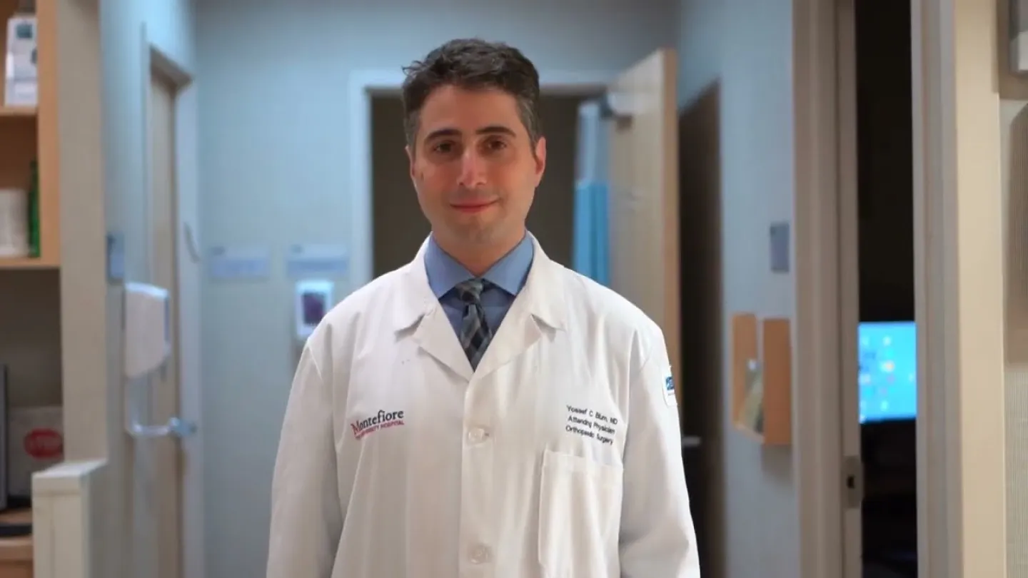 Yossef Blum, MD standing in hospital hallway