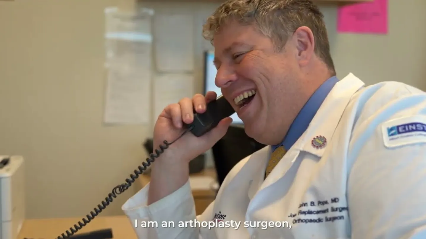 John Pope, MD talking on the phone