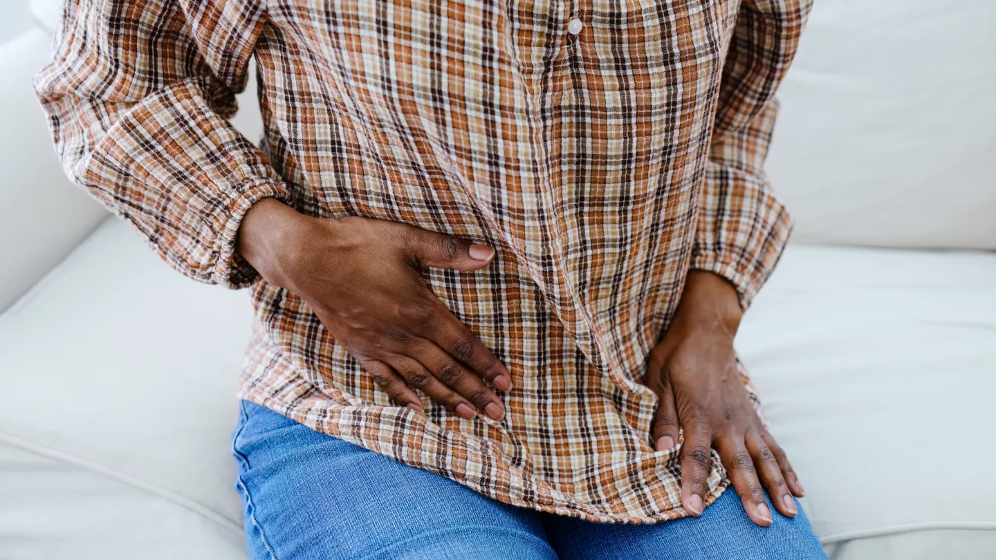 Woman Holds Abdomen