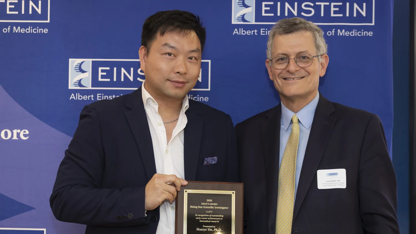 Shanye Yin, PhD, received the inaugural Dean’s Rising Star Scientific Investigator Award from Einstein Dean Yaron Tomer, MD, at the Spring Faculty Celebration held on June 3, 2026. in Lubin Dining Hall. 