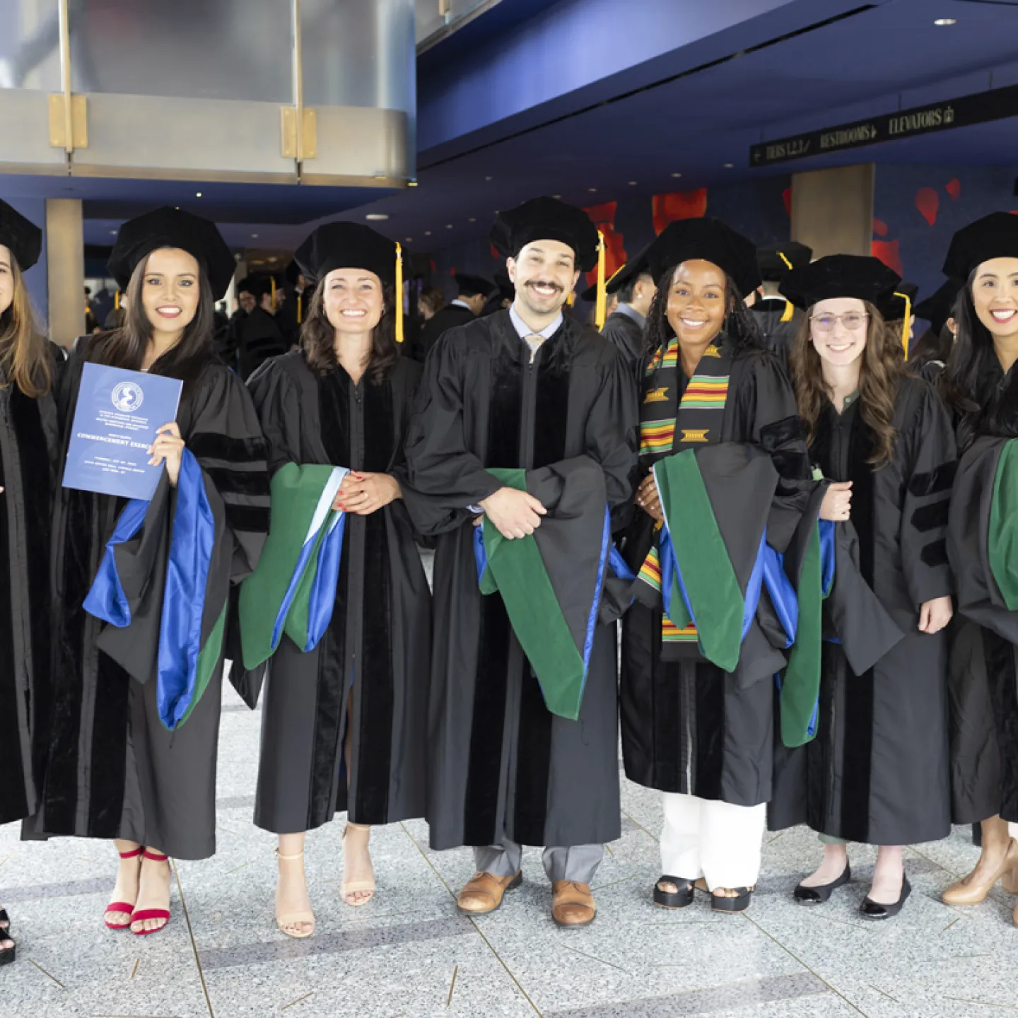 group of students posing for a picture at graduation