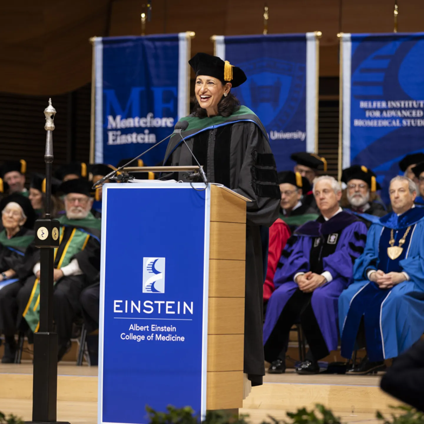 woman giving a speech at graduation