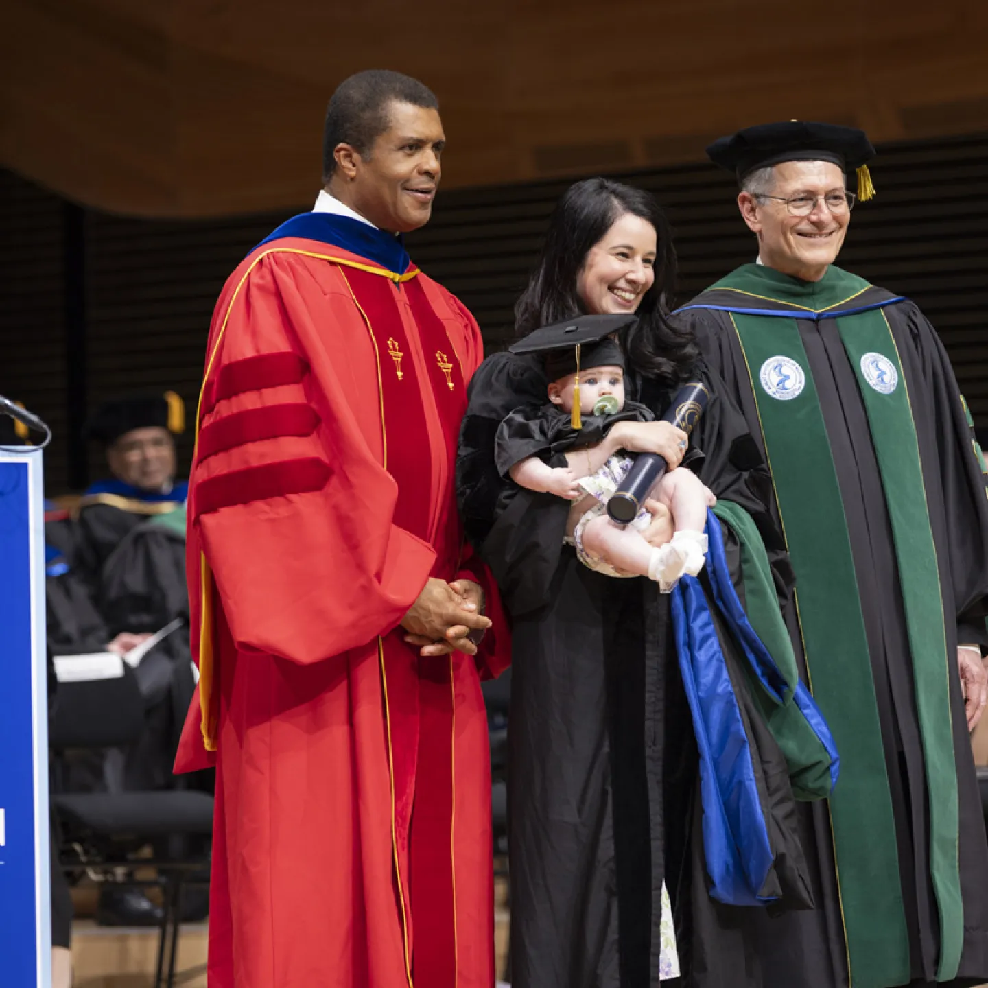 Dr. Ozuah and Dr. Tomer with student and her child