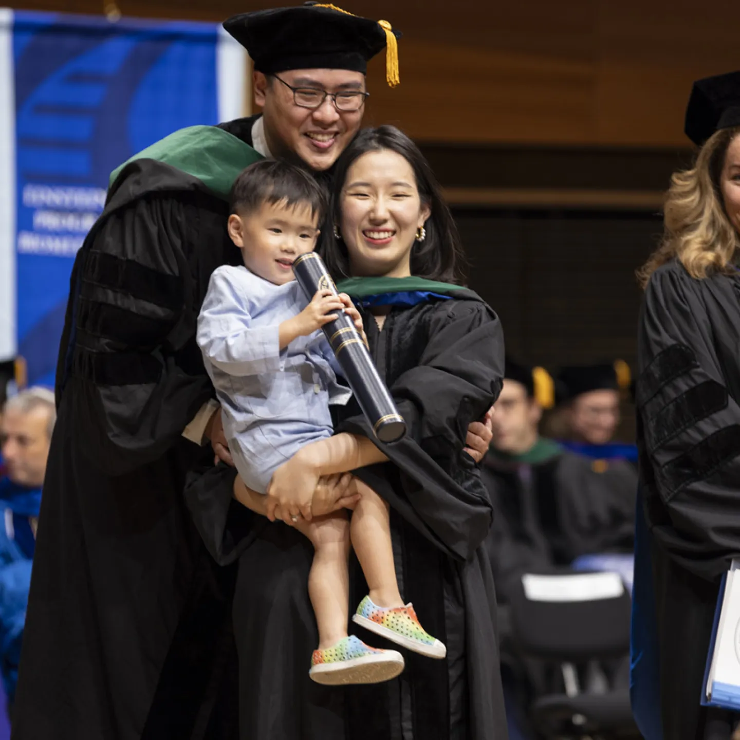 Couple holding their child