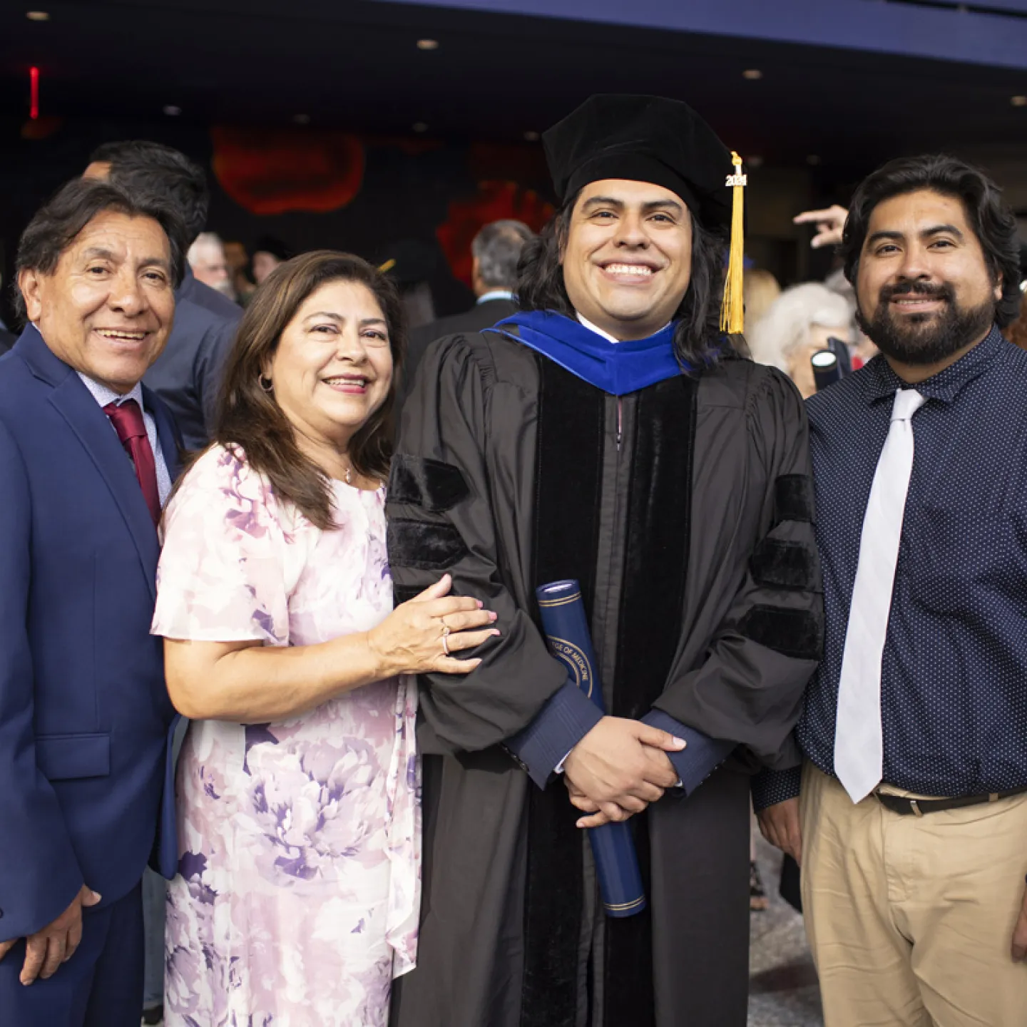 family taking a picture with graduate