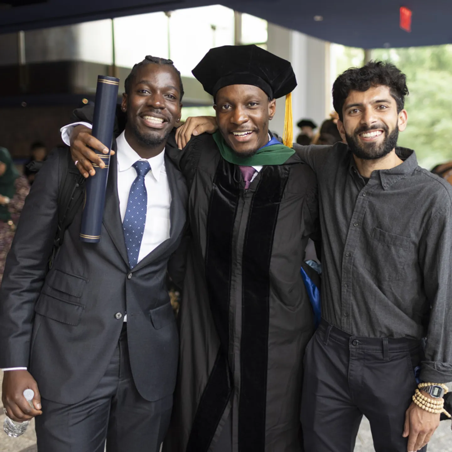 graduate taking a photo with friends