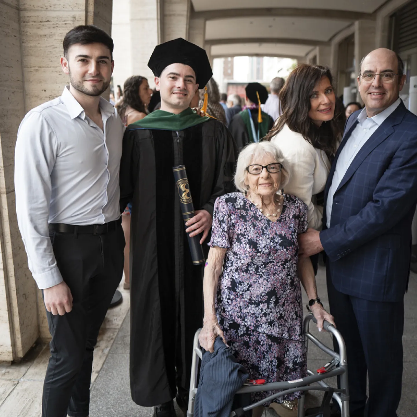 graduate with his family