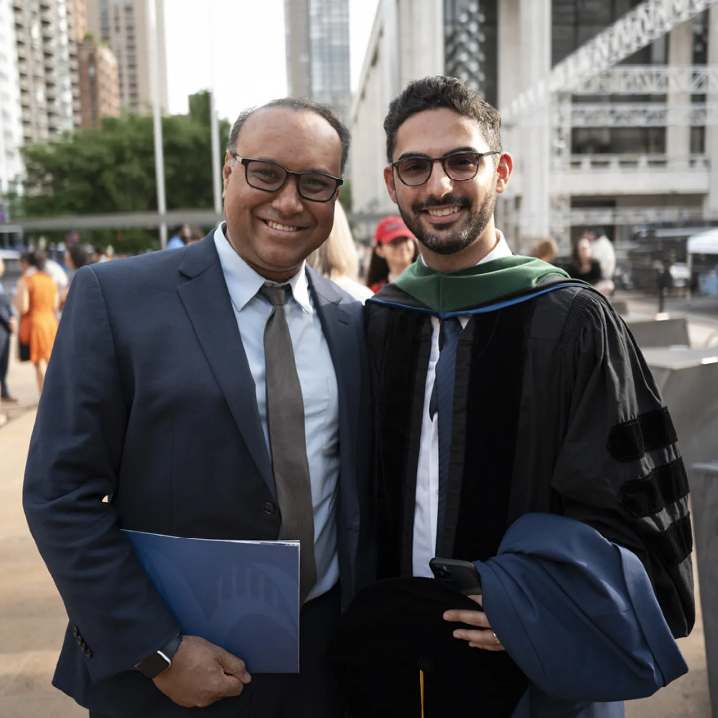 student posing with friend