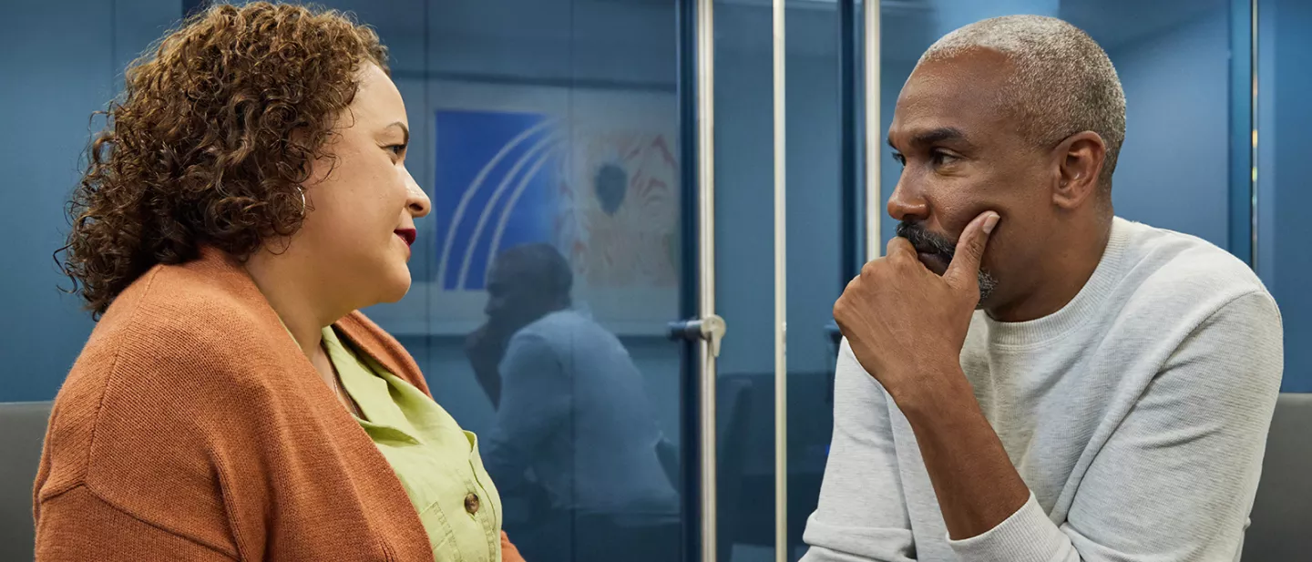 Woman talking to a man