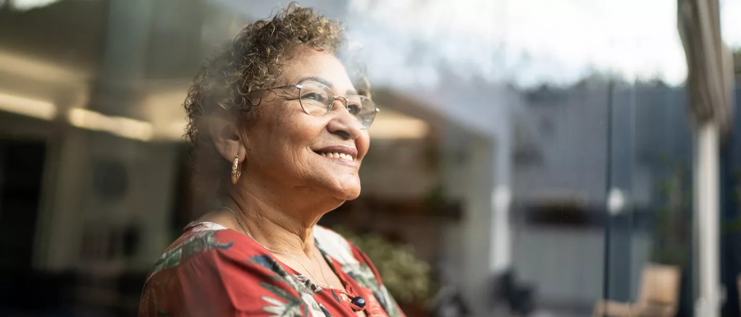 Woman looks off to side smiling