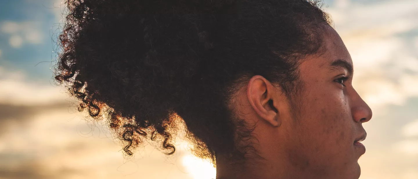 Profile of young man at sunset with determined expression
