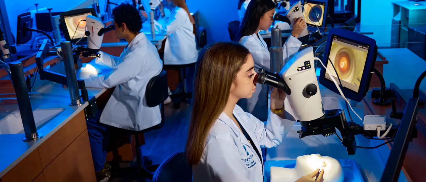 Residents at work in the Microsurgical Simulation Laboratory