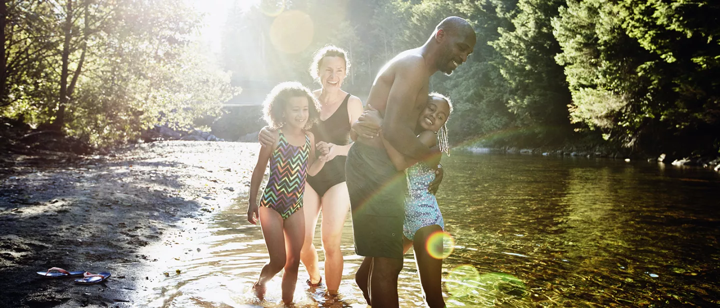Family playing in a lake