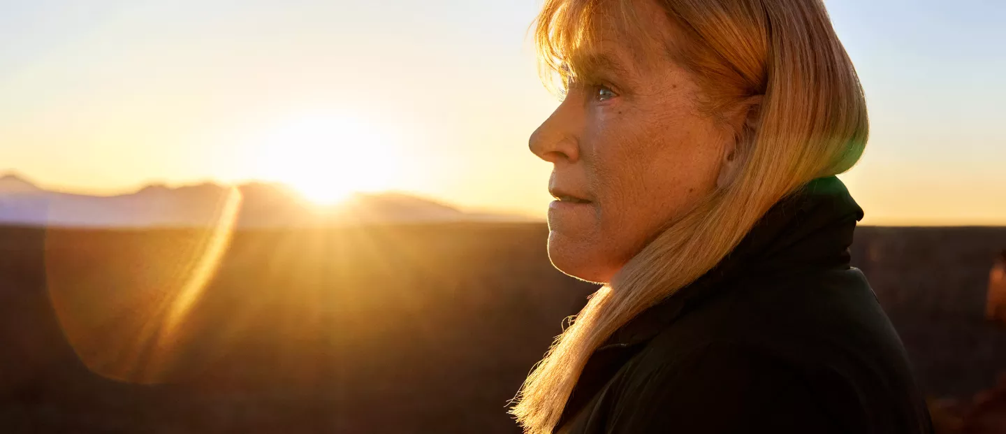 Barbara looking off at the Grand Canyon at sunset