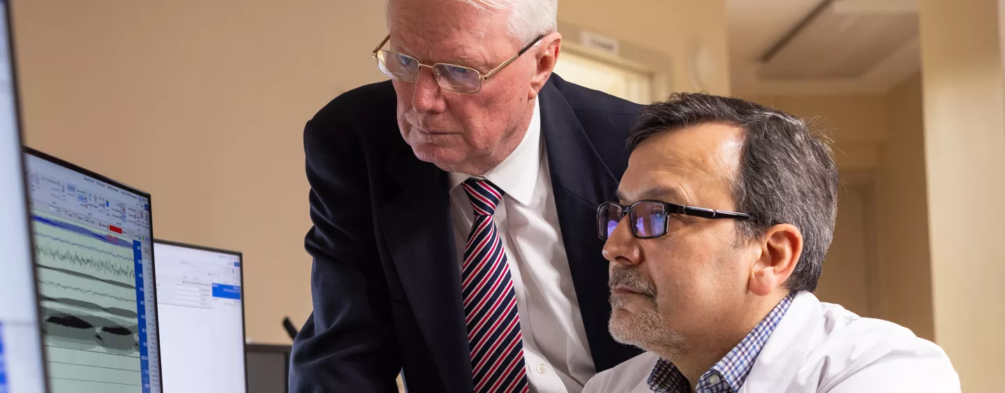 Two physicians looking at a computer screen