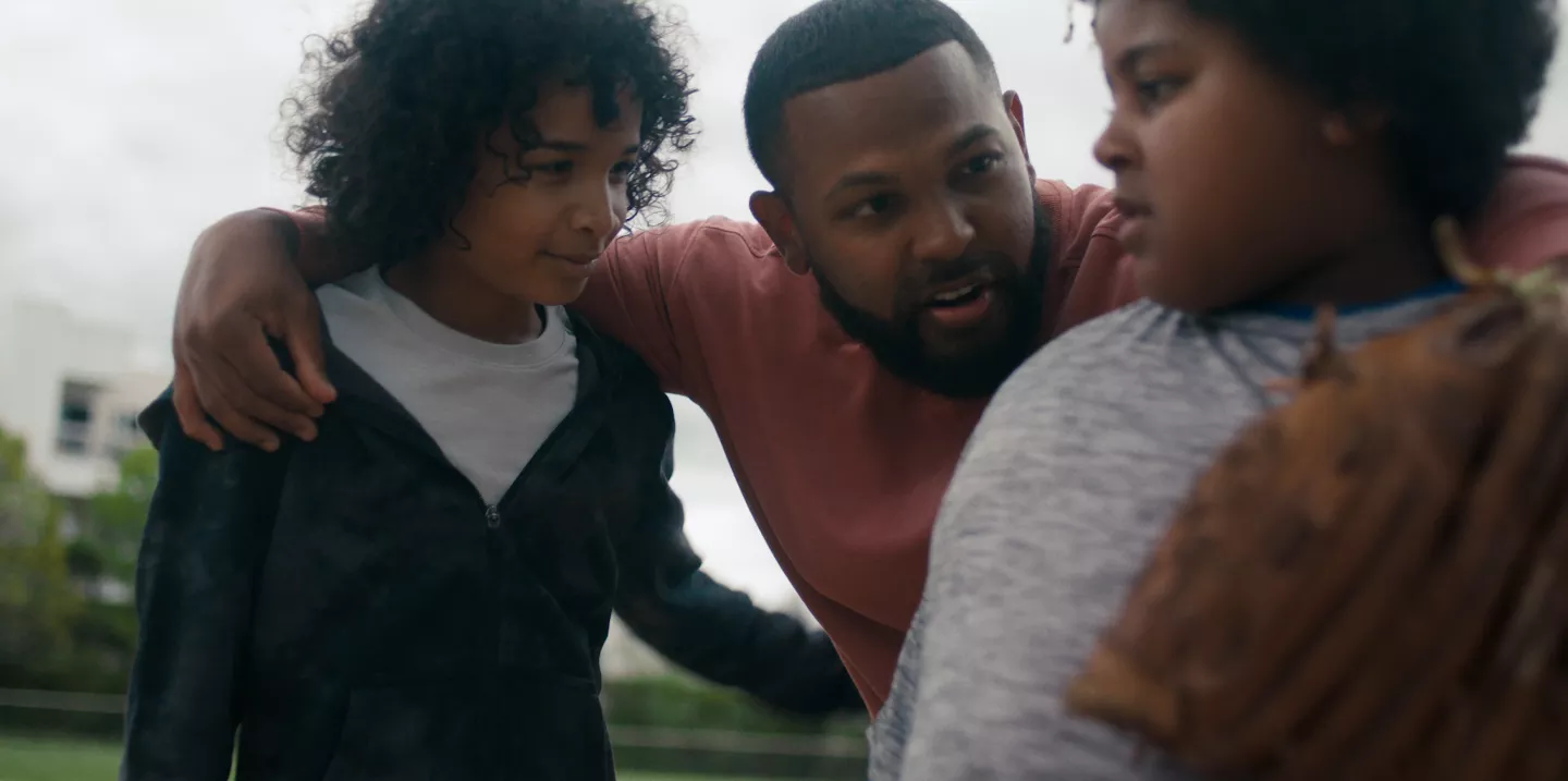 Onil playing baseball with kids in his neighborhood.