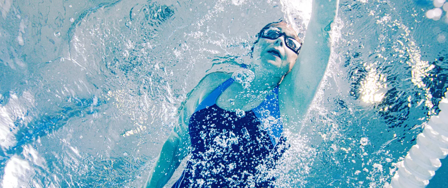 A woman swimming in a pool.