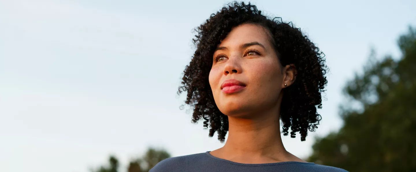 A woman looking up and smiling