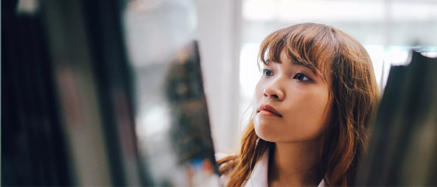 Young medical professional looking at display