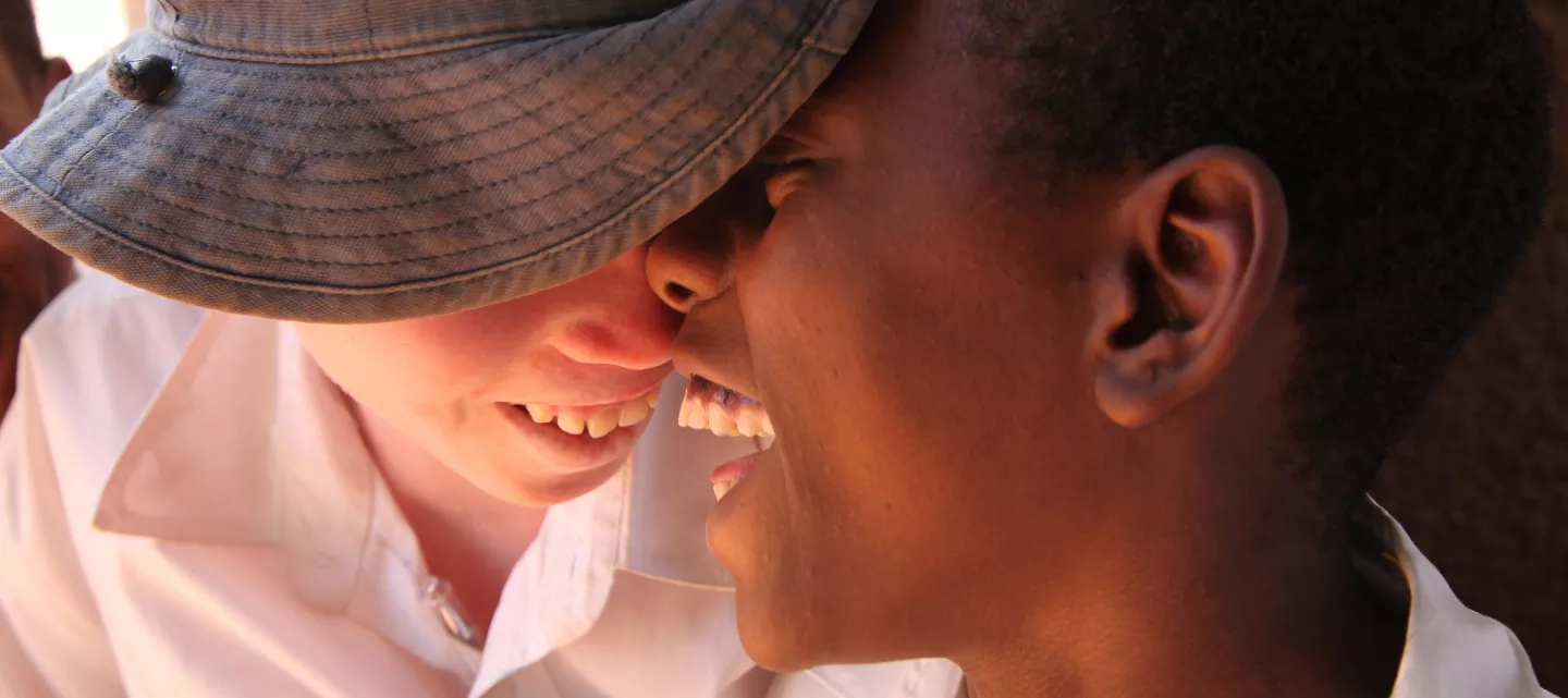Two brothers smiling and embracing