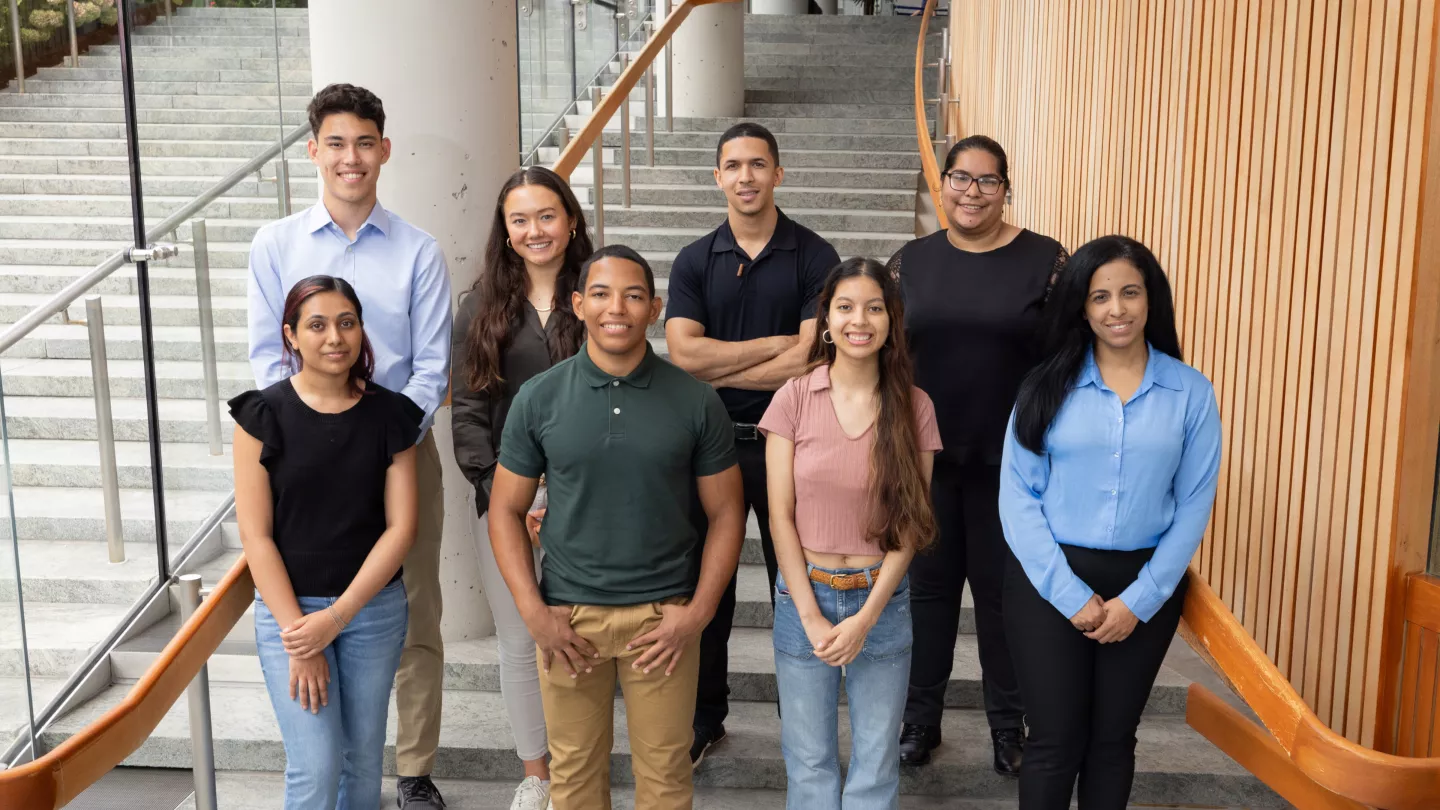 Group photo of Beyond Albert program research students on modern stairwell