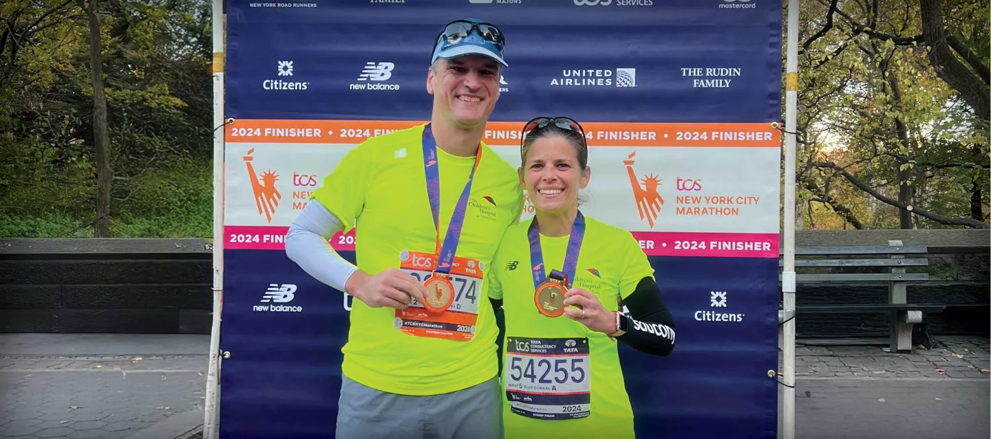 Marathon Hero runners holding their awards
