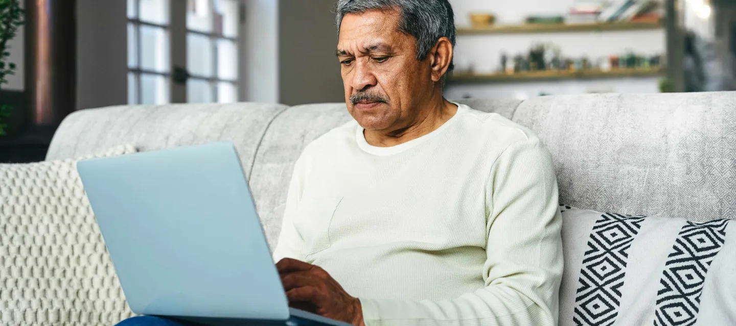 Man looking at his laptop