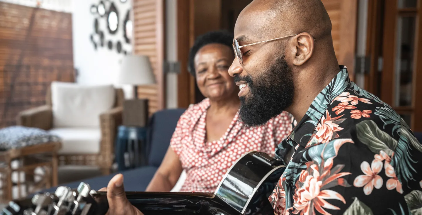 man-playing-guitar-with-smiling-woman.jpg