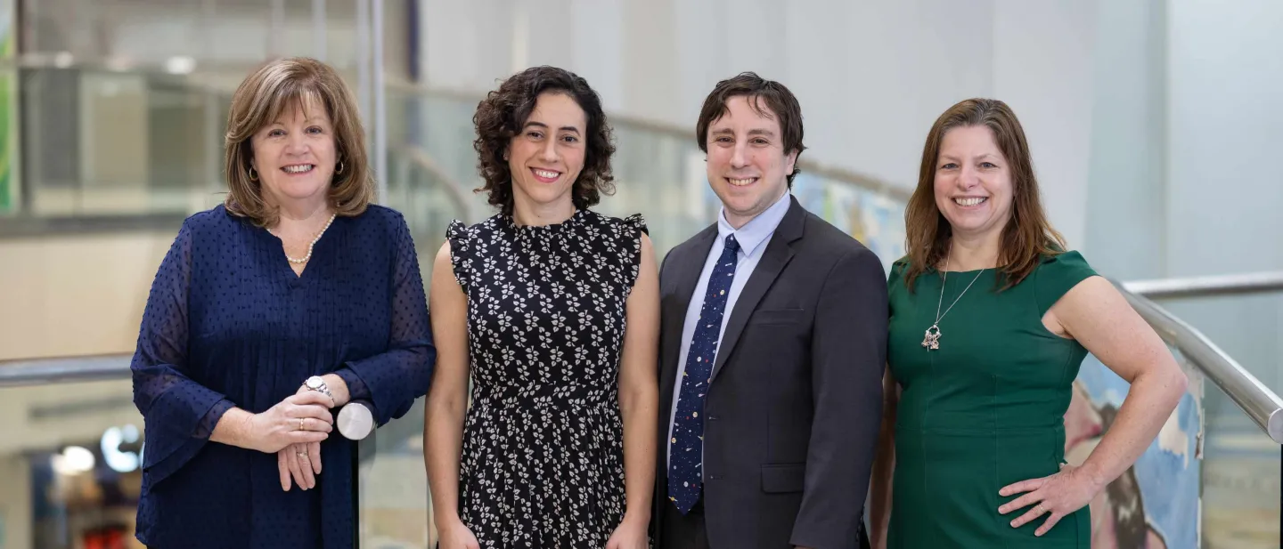 Cham Urology group of four people posing for picture