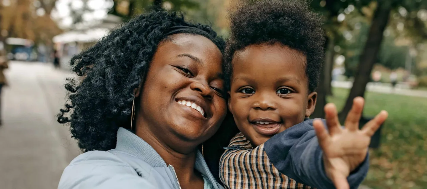 Mother and child taking selfie at the park
