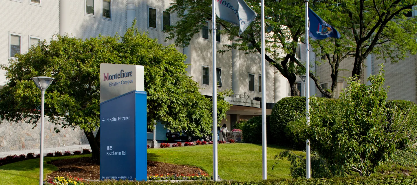 The sign for Jack D. Weiler Hospital, Einstein Campus with green landscaping