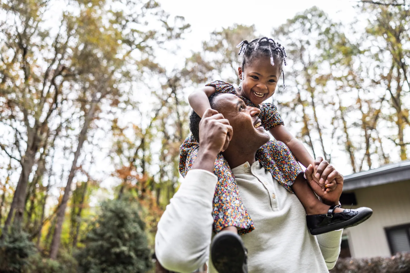 Father carried his baby girl on shoulders