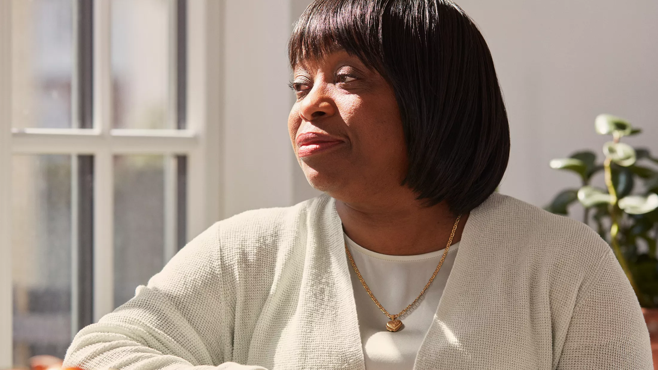 Rebecca looking to her right, thinking