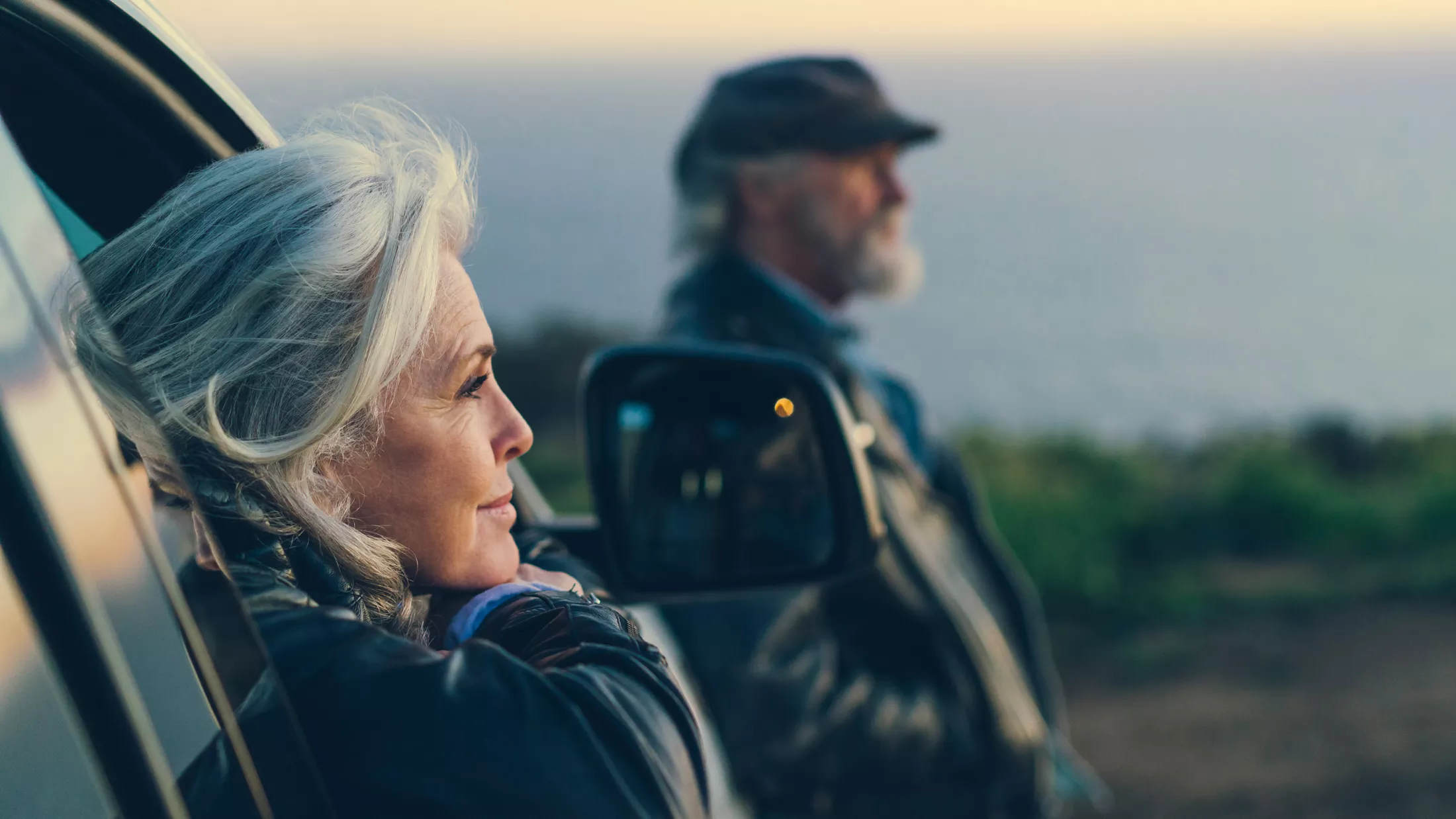 A woman looking outside her car window
