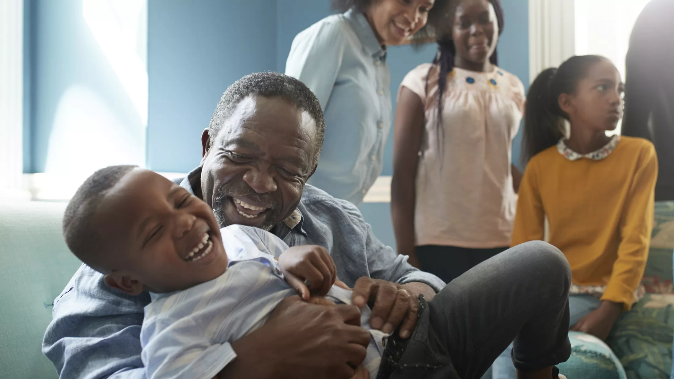 man with grandson giving LP