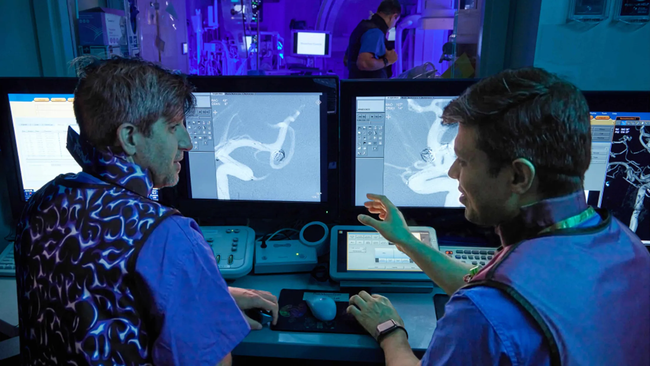 Doctors looking at computer screens