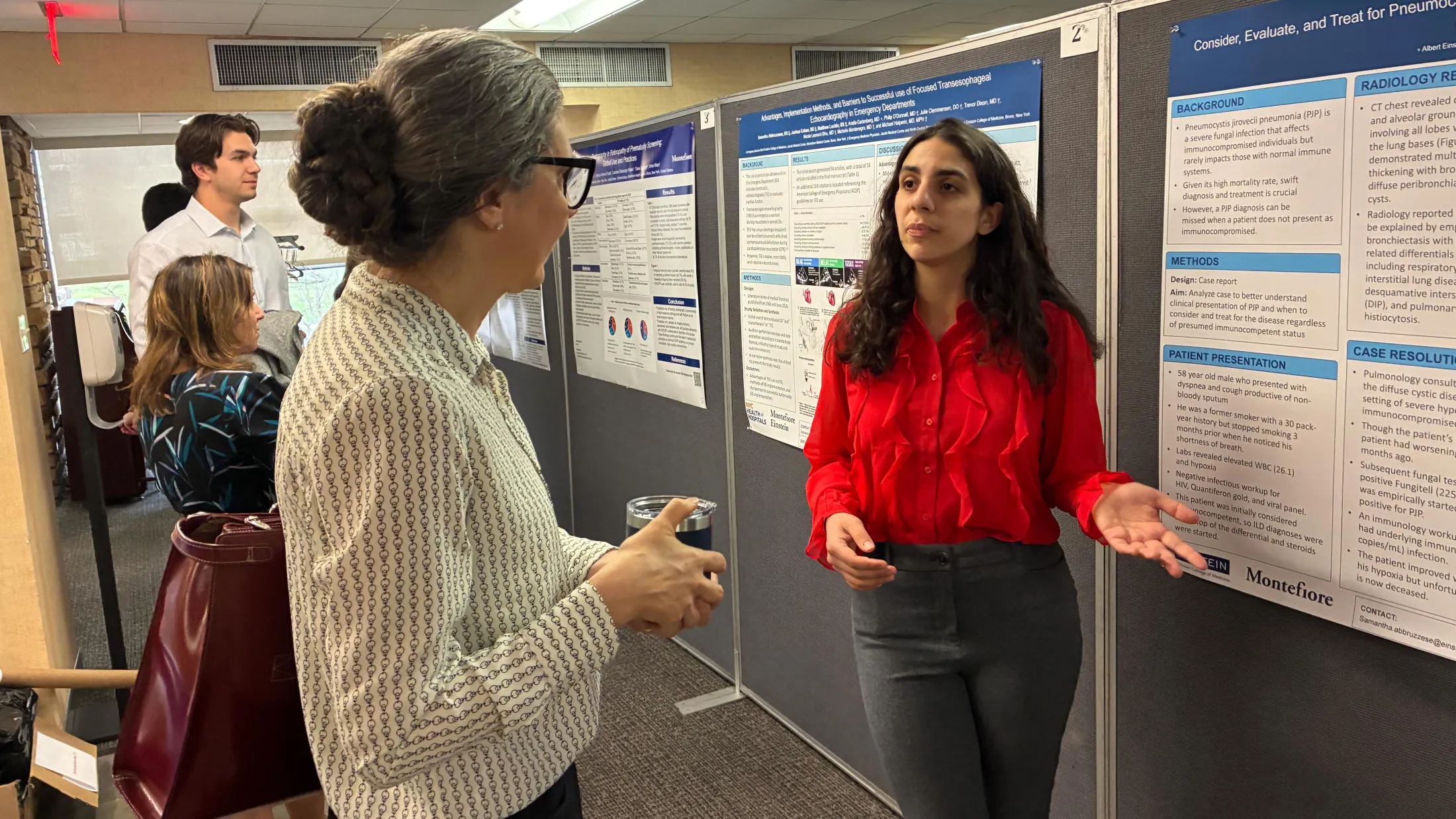 Samantha Abbruzzese describes her research to Amanda Raff, M.D., senior associate dean of medical education