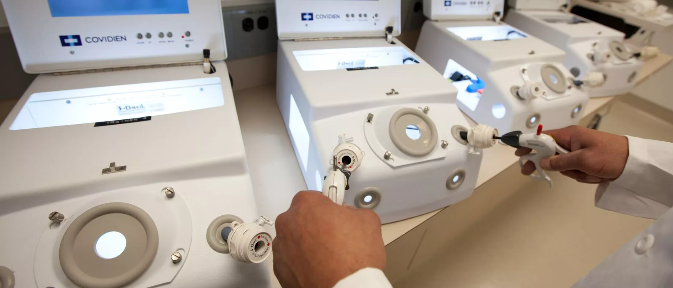 A physician using a minimally invasive surgery simulator 