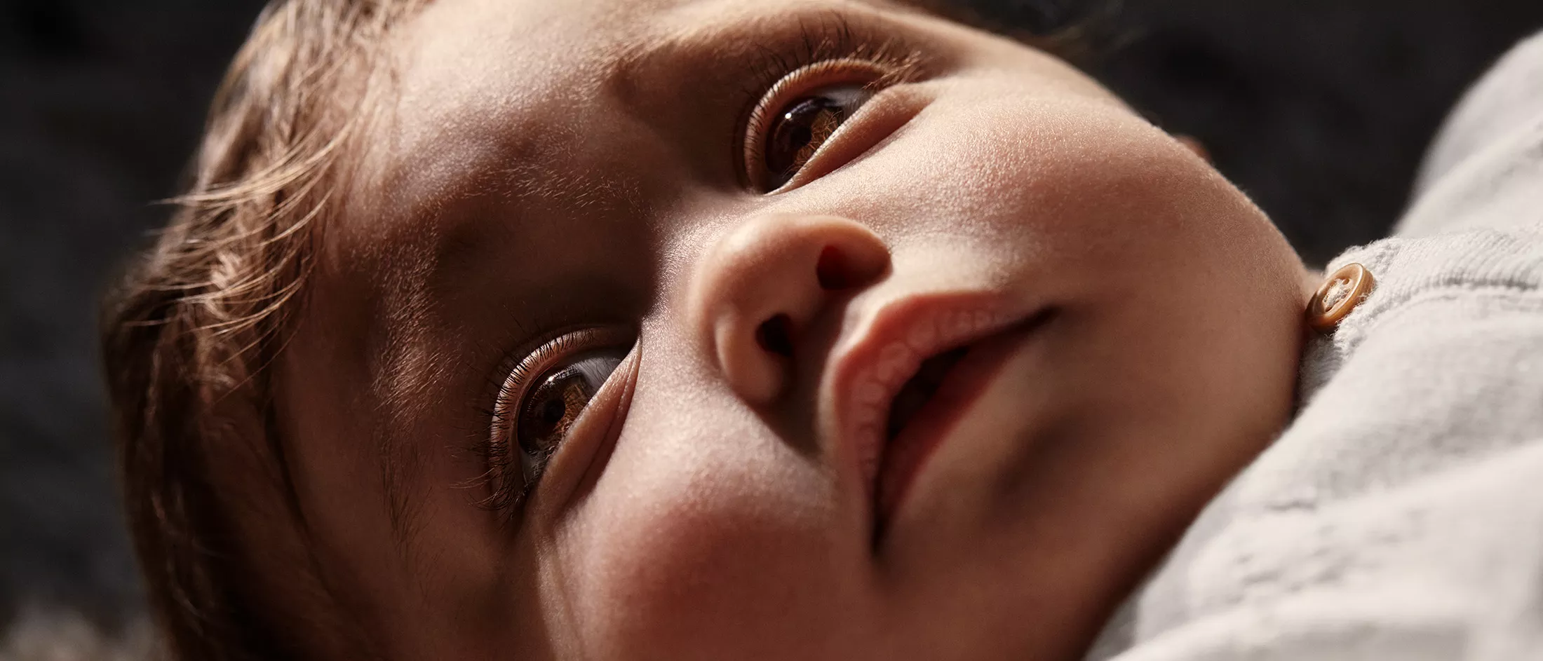 Baby Adriana laying down and looking up