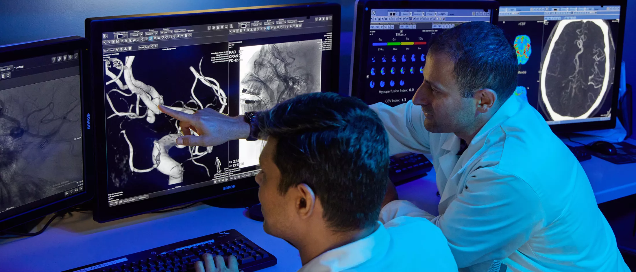 Two physicians looking at a computer screen