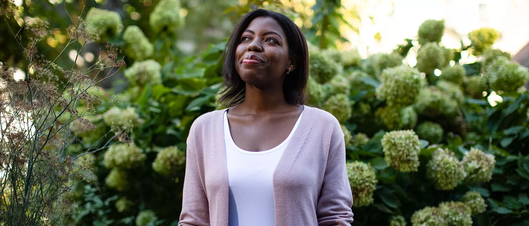 Erica Guthrie standing in a garden